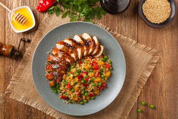 Grilled chicken breast in teriyaki sauce. Served with brown rice and vegetables.