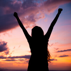 Fototapeta premium woman gesturing success - silhouette over evening sky