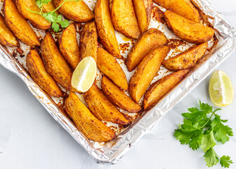 Baked Potato Wedges with Cilantro and Lemon Directly Above Photo