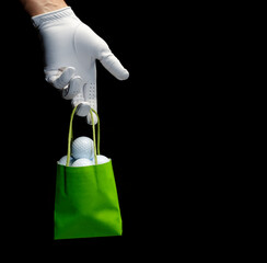 Player wearing a golf glove holding a bag full of golf balls.