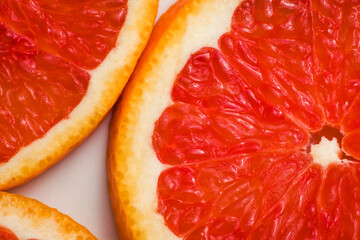 Macro Round Fresh Juicy Sliced Slices Of Red Citrus Orange. Pieces of Grapefruit Fruit Isolated, Close-up. The Concept Of Healthy Eating.