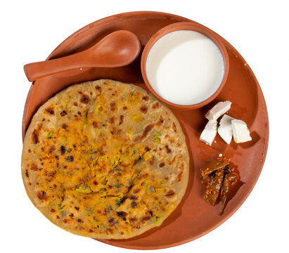 Indian breakfast dish paneer paratha serve with curd or chutney