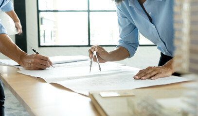 architect or engineer working on table use drawing tool