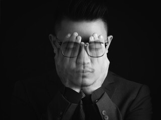 The double exposure image of the businessman thinking overlay with his hand. the concept of...