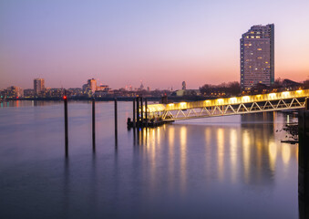 Panoramic view of the Greenland Pier (Surrey Quays) oposite Canary Wharf on the other side of the Thames River at dusk in London
