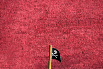 Piratenflagge vor rotem Hintergrund Jolly Roger Flag