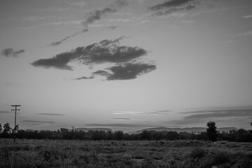 Black and white cloudy sunset at the city