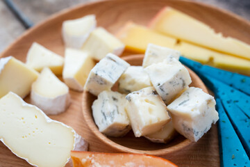 Close up image of different cheese on board