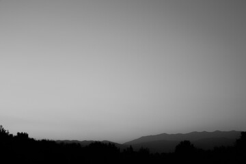 Black and white field and mountains
