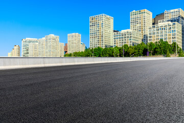 Asphalt road and modern city commercial buildings in Beijing,China.