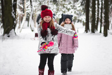 Two beautiful little girls sisters are playing