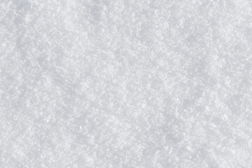 Fototapeta na wymiar White clean shiny snow background texture. fresh snow seamless texture. snowy surface closeup