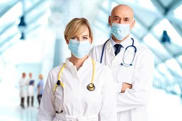Medical team standing together on the hospital's foyer and wearing face masks