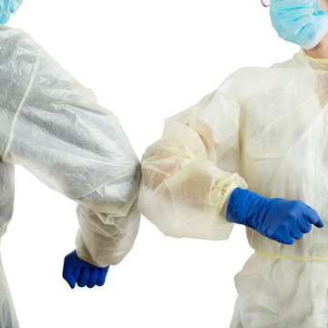 Male And Female Medical Co-workers Greet Each Other With  Elbow Bump To Avoid Virus Spread Or Contamination. White Background