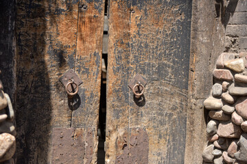 Abandoned wooden doors and hangers of ancient Chinese buildings