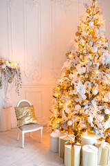 luxurious expensive light interior living room in a royal style decorated with a very beautiful Christmas tree and large windows