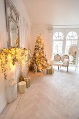 luxurious expensive light interior living room in a royal style decorated with a very beautiful Christmas tree and large windows