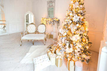 Fototapeta na wymiar luxurious expensive light interior living room in a royal style decorated with a very beautiful Christmas tree and large windows