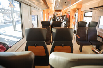 Fototapeta na wymiar interior of a train. Empty tram in Germany. Empty train with black seats
