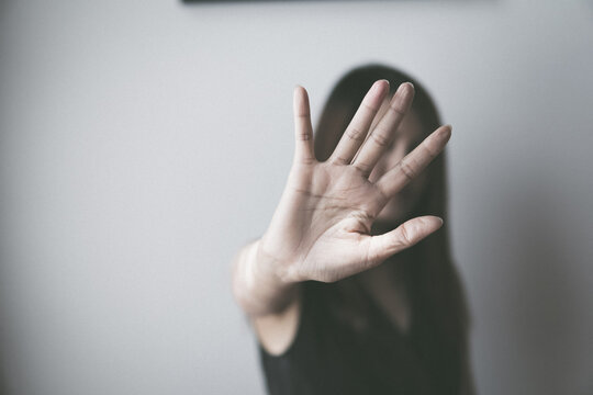sexual abuse for women gender in society, a girl hand is stopping harassment on the bedroom of family. stop violence against Women, international women's day.