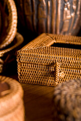 Obraz premium Beautiful composition of wicker and reed boxes and baskets for decoration or organizing. Boho or indian style.