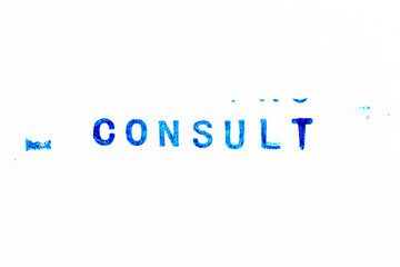 Blue color ink of rubber stamp in word consult on white paper background