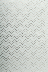 Vertical image of wrapping paper with zigzag decorative ines.Empty space