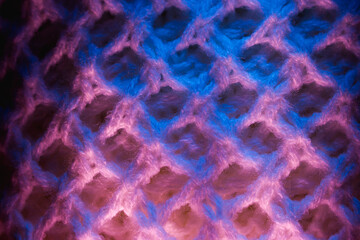 Close-up of fluffy soft textile. Abstract fabric with knit texture for background.