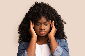 Fototapeta na wymiar Closeup of upset african american lady having headache, grey background