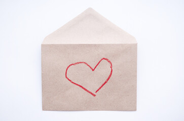 drawing heart on craft envelope. Eco friendly valentine day