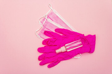Fashion masks glamour gloves and sanitizer isolated on pink background