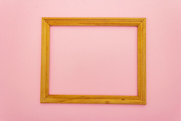 Wooden frame for Valentine Day or Wedding concept on pink background