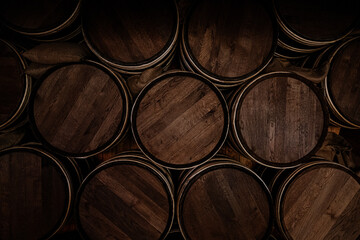 stack of wooden wine barrels