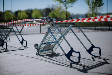 Front view of barrier made of shopping carts on parking lot