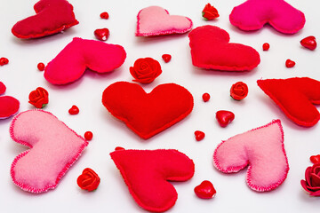 Assorted red and pink hearts isolated on white background