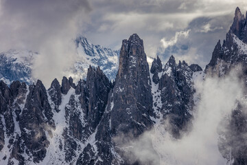 Fototapeta na wymiar The Cadini di Misurina mountain range, with dramatic clouds, near Cortina d'Ampezzo, in the Italian Dolomites