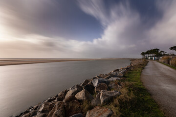 dusk on the sea and nature reserve Casse de la Belle Henriette, effects of environemental changes and global warning can be seen with ocean gaining space over the beach and land, Vendee, France