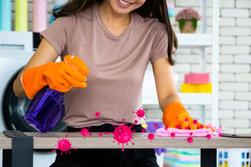 Double exposure virus covid-19 young Asian women are using an antidote. Clean the table