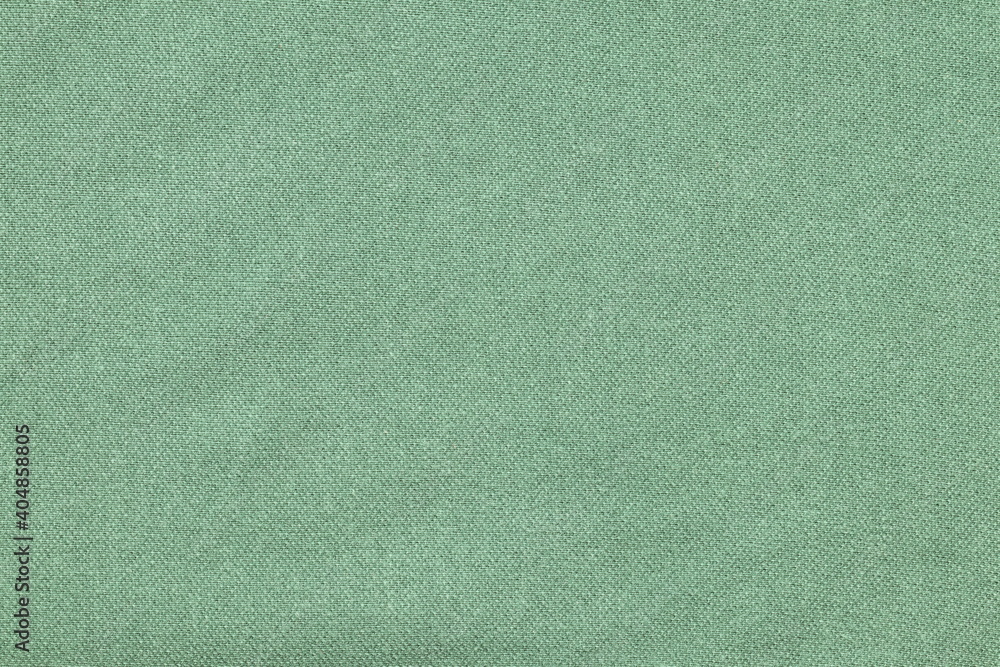 Wall mural Green fabric texture for clothing.