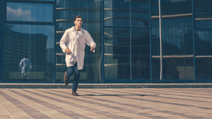 doctor with a stethoscope runs quickly along a city street.