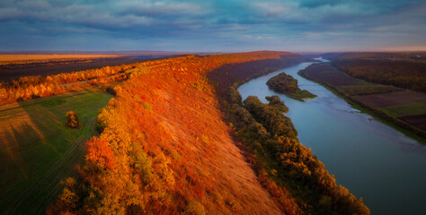 Beautiful top view of winding river in sunset. Scenic image of drone photography.