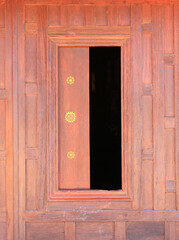 Open window. Thai style wooden windows on brown wood wall background