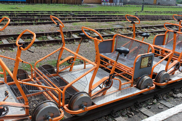 Uherce Mineralne, Poland - September 05, 2018: Many rail-cycle draisine with four wheels.