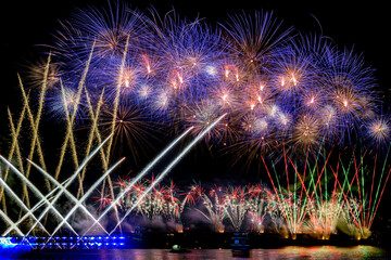 Celebratory colorful bright festive fireworks on night sky, aesthetic and entertainment purposes,firework is as part of a fireworks show or pyrotechnics