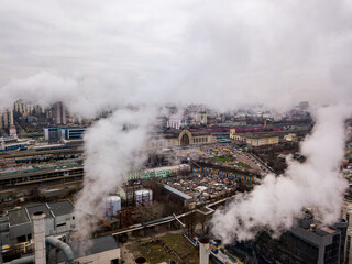 Aerial drone view. The building of the Kiev railway station through the white smoke from the chimneys.