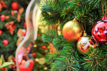 Christmas tree decorated with shiny colorful balls decoration.