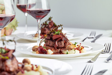 Gourmet appetizer: Beautifully decorated catering banquet foie gras with berries © Georgii
