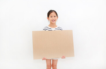Smiling asian little girl holding empty brown big board for media banner isolated on white...