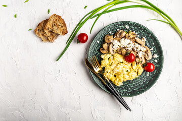 Scrambled eggs with toast mushrooms, onion and tomatoes. banner, catering menu recipe place for text, top view