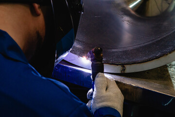Welders working at the factory made metal.